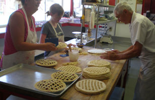 Bakers working on pies at the onsite Oldfield Orchard Bakery
